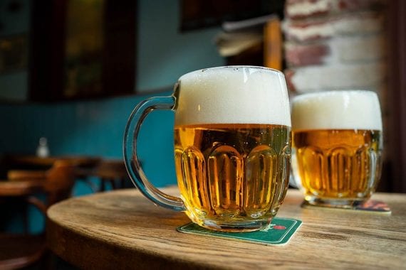 Photo of two pints of beer on a table