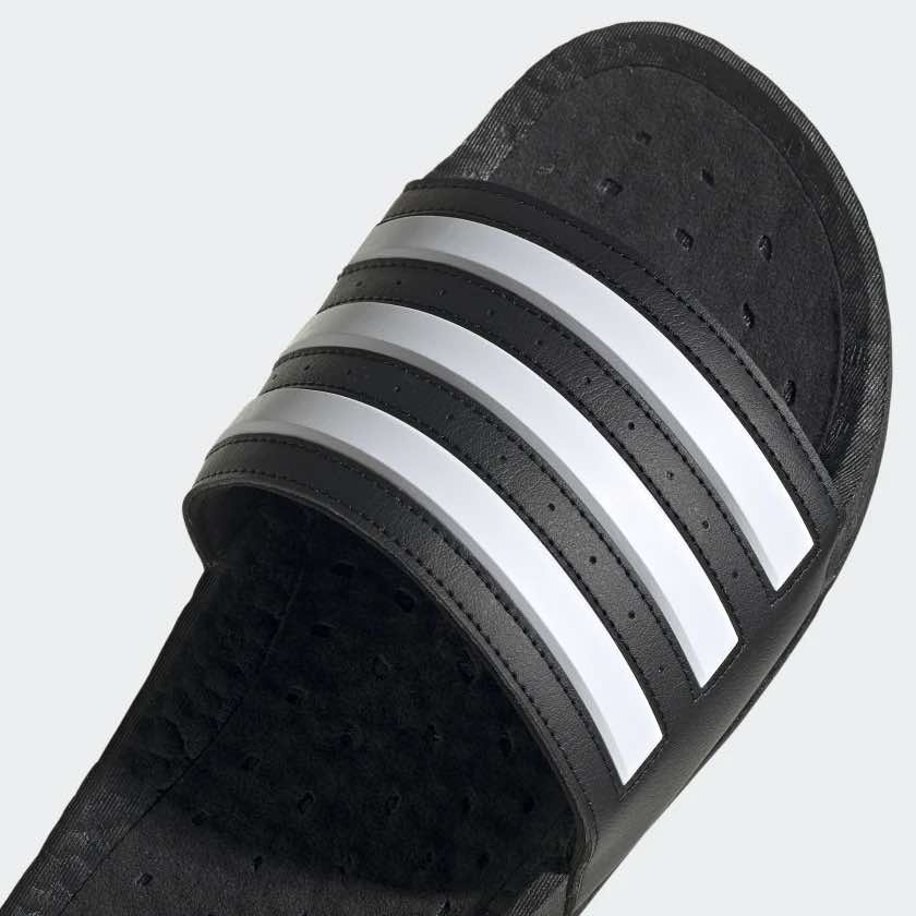 A photo from Adidas.com showing the closeup details of a black sandal