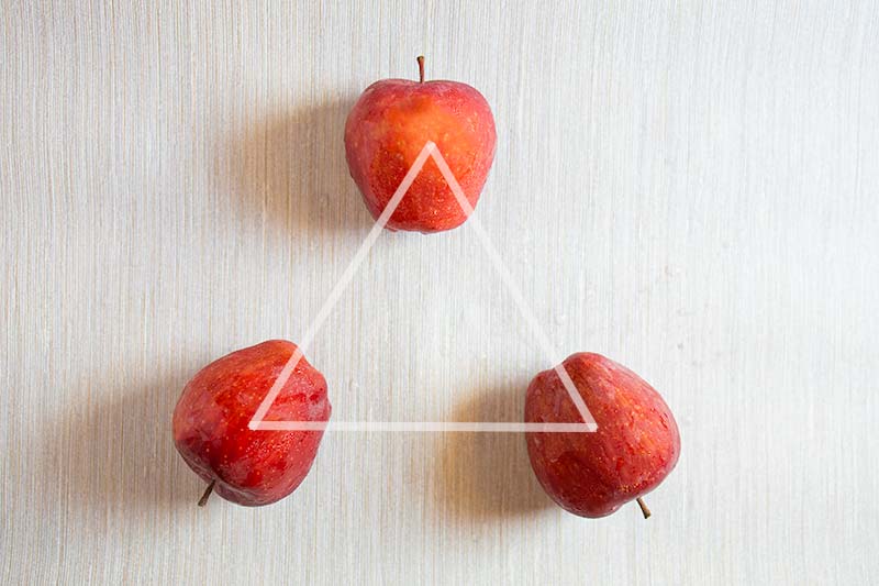 Image from PhotoAxis.com of three apples in a triangle.